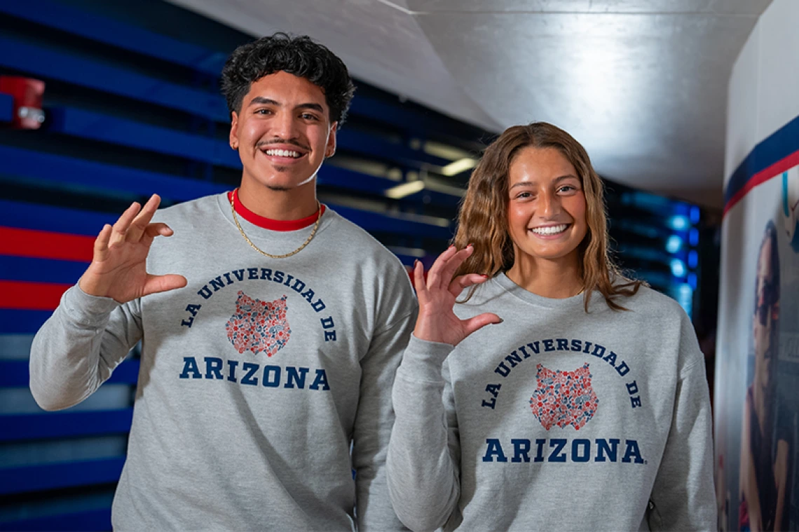 Two students smiling and posing for photo